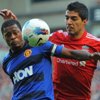 Patrice Evra and Luis Suarez